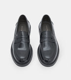 Men's glossy black penny loafers with rounded toes and low heels