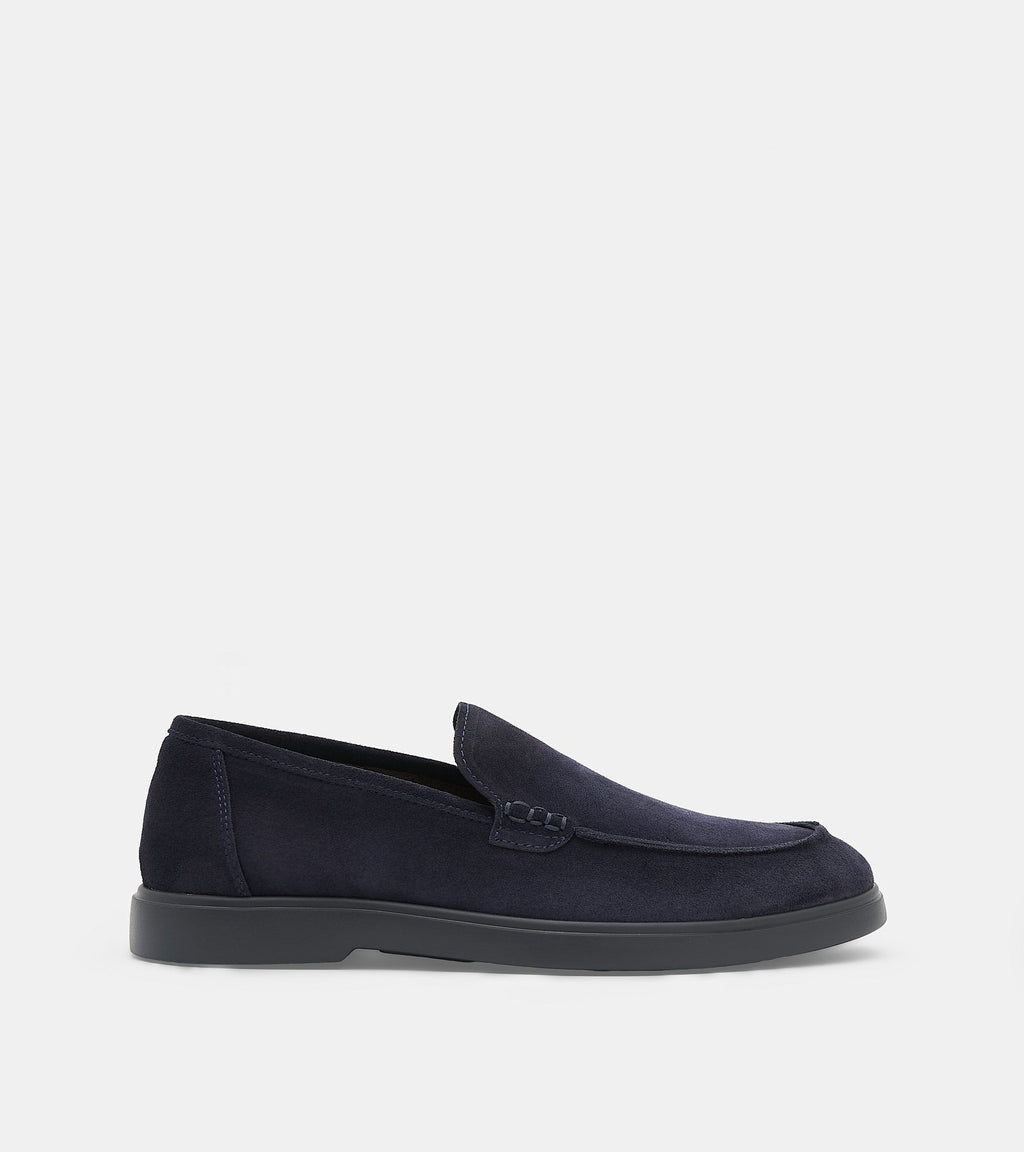 Men's navy blue slip-on loafers with penny strap detail and flat sole