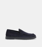 Men's navy blue slip-on loafers with penny strap detail and flat sole