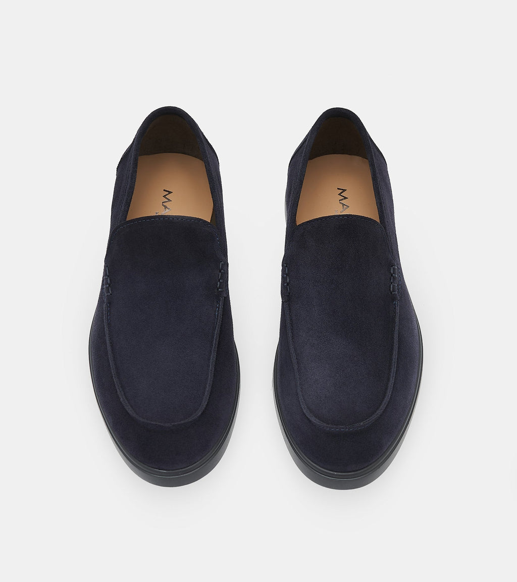 Men's navy blue slip-on loafers with penny strap detail and flat sole