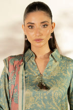 Woman wearing a blue printed longline shirt with collared V-neck and pink patterned dupatta