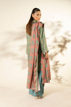 Woman wearing a blue printed longline shirt with collared V-neck and pink patterned dupatta