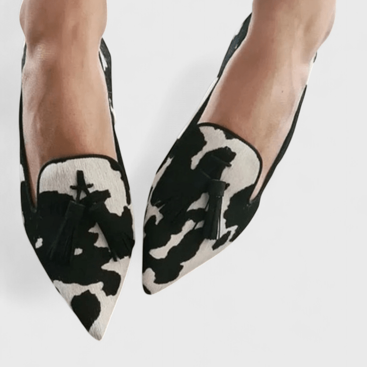 Women's pointed animal print loafers with tassel detail