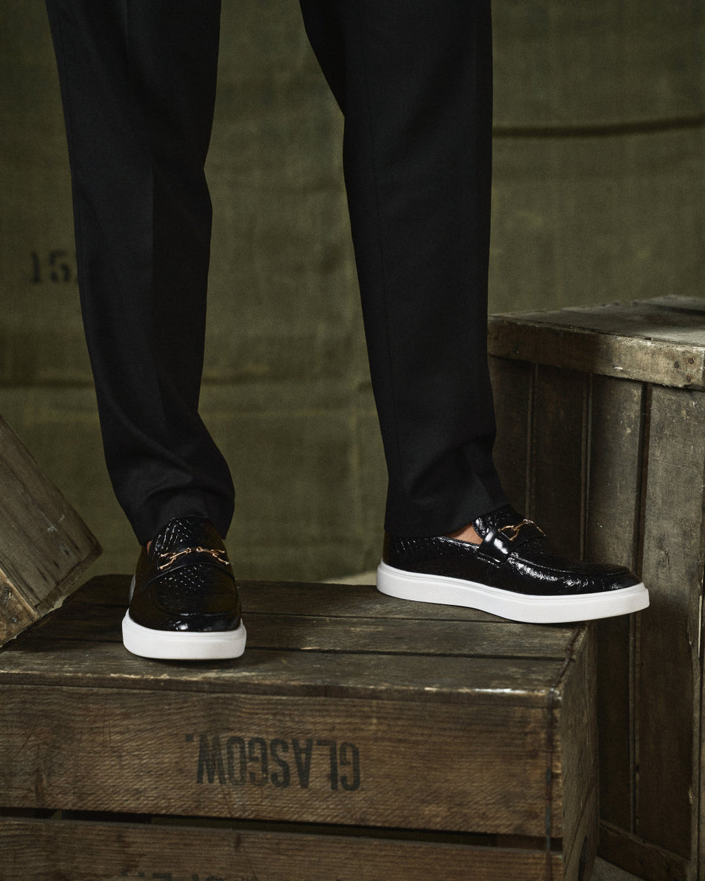Embossed slip-on loafers with metal bit details and white platform soles