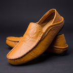 Unisex slip-on moc toe loafers with stitched apron detailing and flat soles