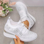 Women's low-top lace-up trainers with geometric decorative detailing and platform soles