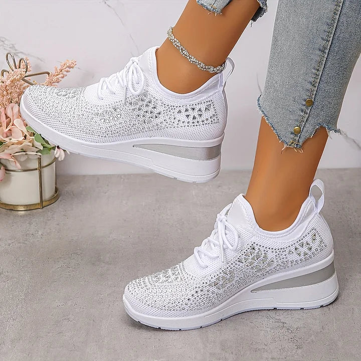 Women's low-top lace-up trainers with geometric decorative detailing and platform soles