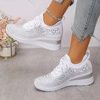 Women's low-top lace-up trainers with geometric decorative detailing and platform soles