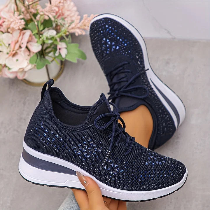 Women's low-top lace-up trainers with geometric decorative detailing and platform soles