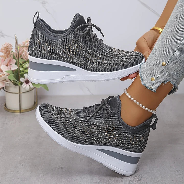 Women's low-top lace-up trainers with geometric decorative detailing and platform soles