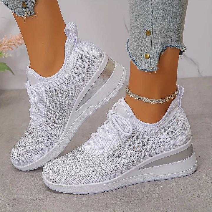 Women's low-top lace-up trainers with geometric decorative detailing and platform soles