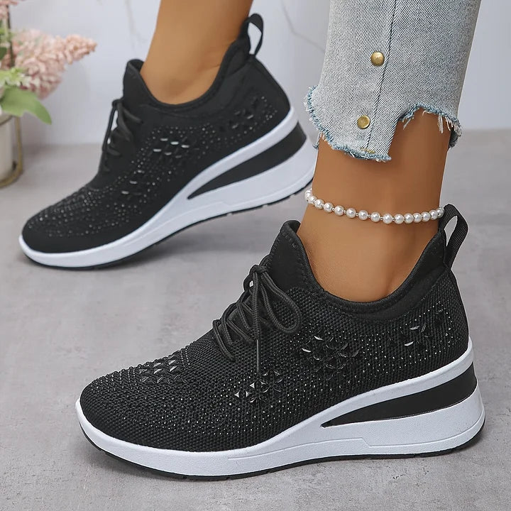 Women's low-top lace-up trainers with geometric decorative detailing and platform soles