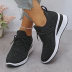 Women's low-top lace-up trainers with geometric decorative detailing and platform soles