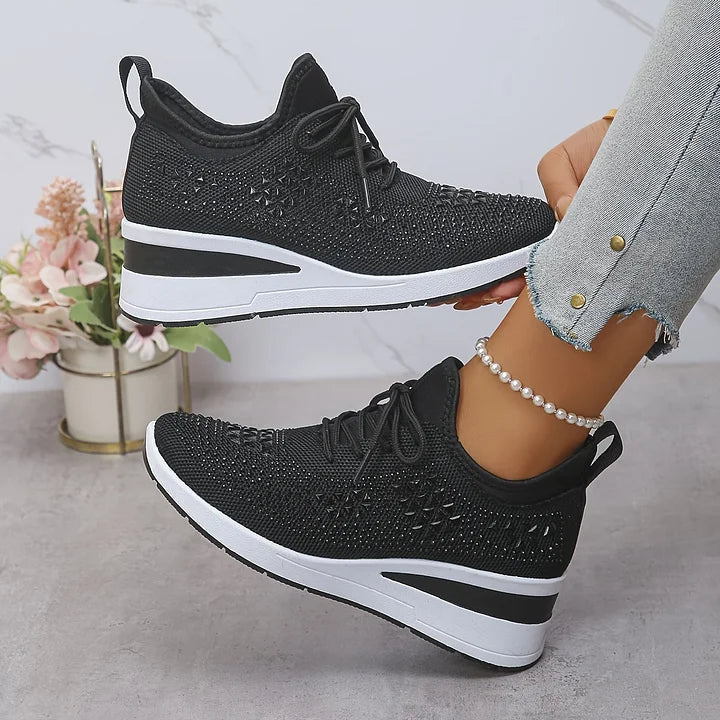 Women's low-top lace-up trainers with geometric decorative detailing and platform soles