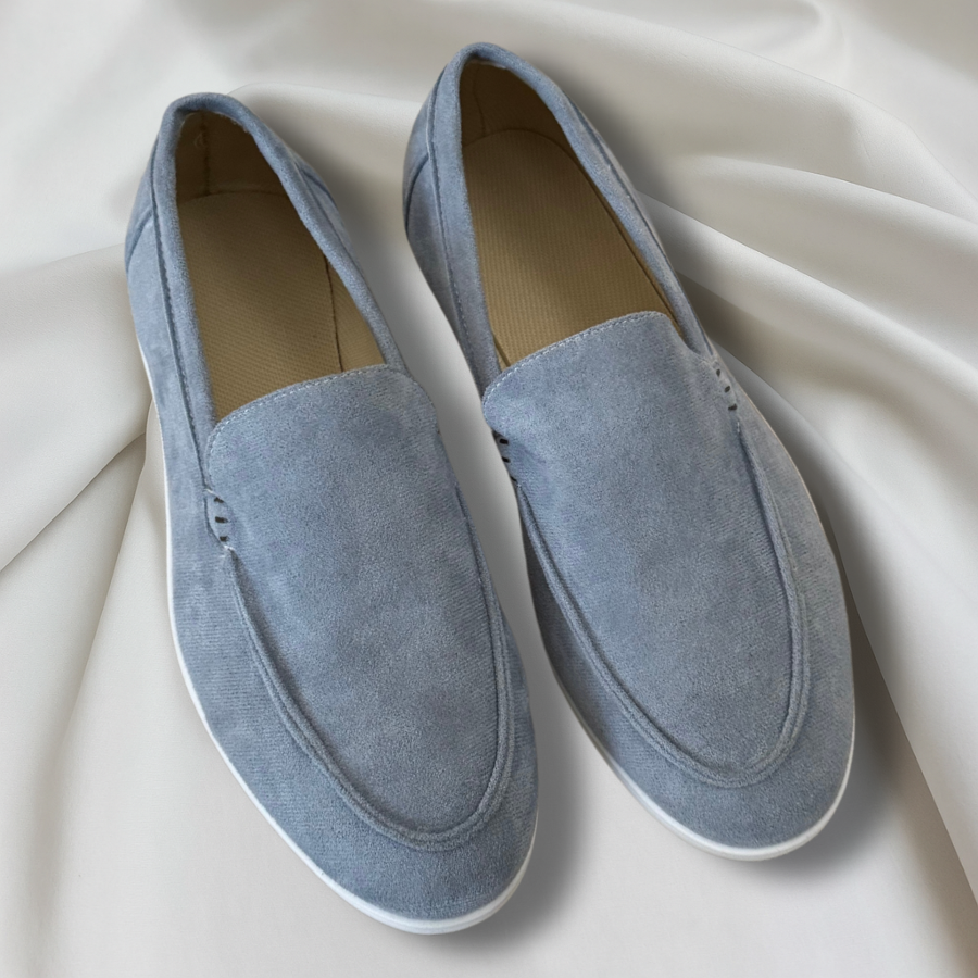 Men's slip-on loafers with rounded toes, stitched apron detailing and flat light-coloured soles