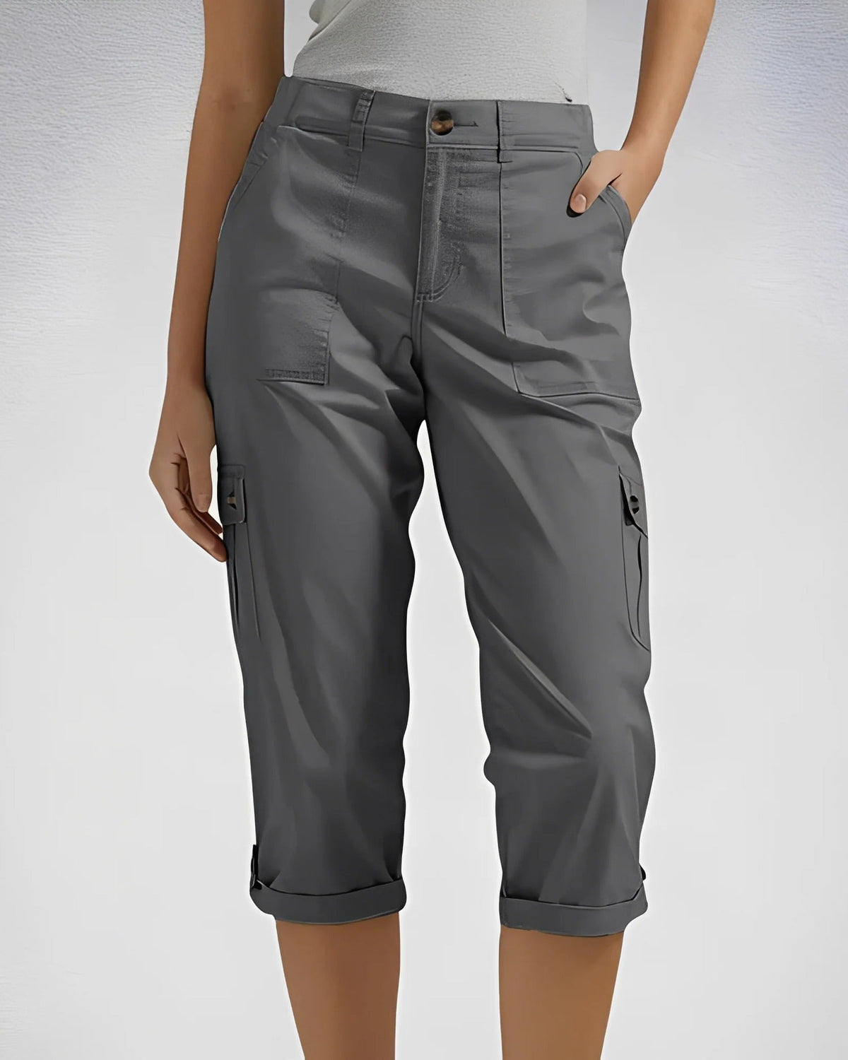 Women's cropped cargo trousers with rolled cuffs and multiple utility pockets