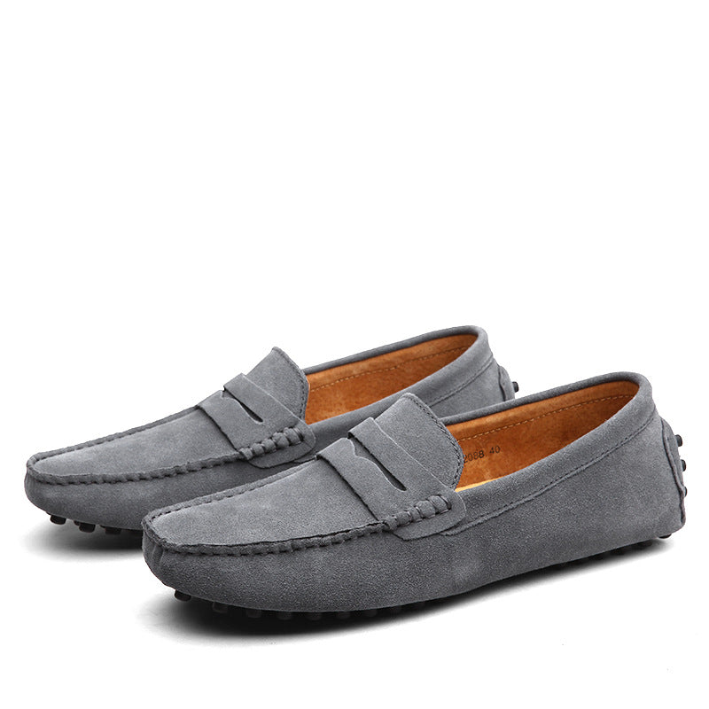 Men's slip-on penny loafers with moc toe stitching and flat treaded soles