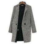 Women's long black and white herringbone coat with notched collar and button fastening