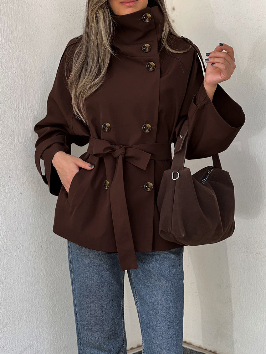 Women's brown double-breasted trench jacket with high collar and waist belt