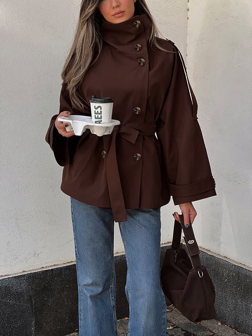 Women's brown double-breasted trench jacket with high collar and waist belt