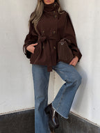 Women's brown double-breasted trench jacket with high collar and waist belt