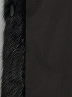 Women's black faux fur hooded coat with long sleeves and flared mid-calf shape