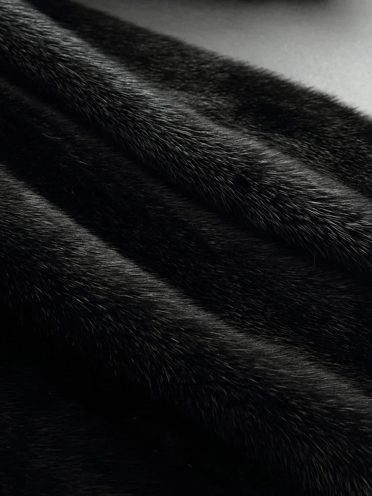 Women's black faux fur hooded coat with long sleeves and flared mid-calf shape