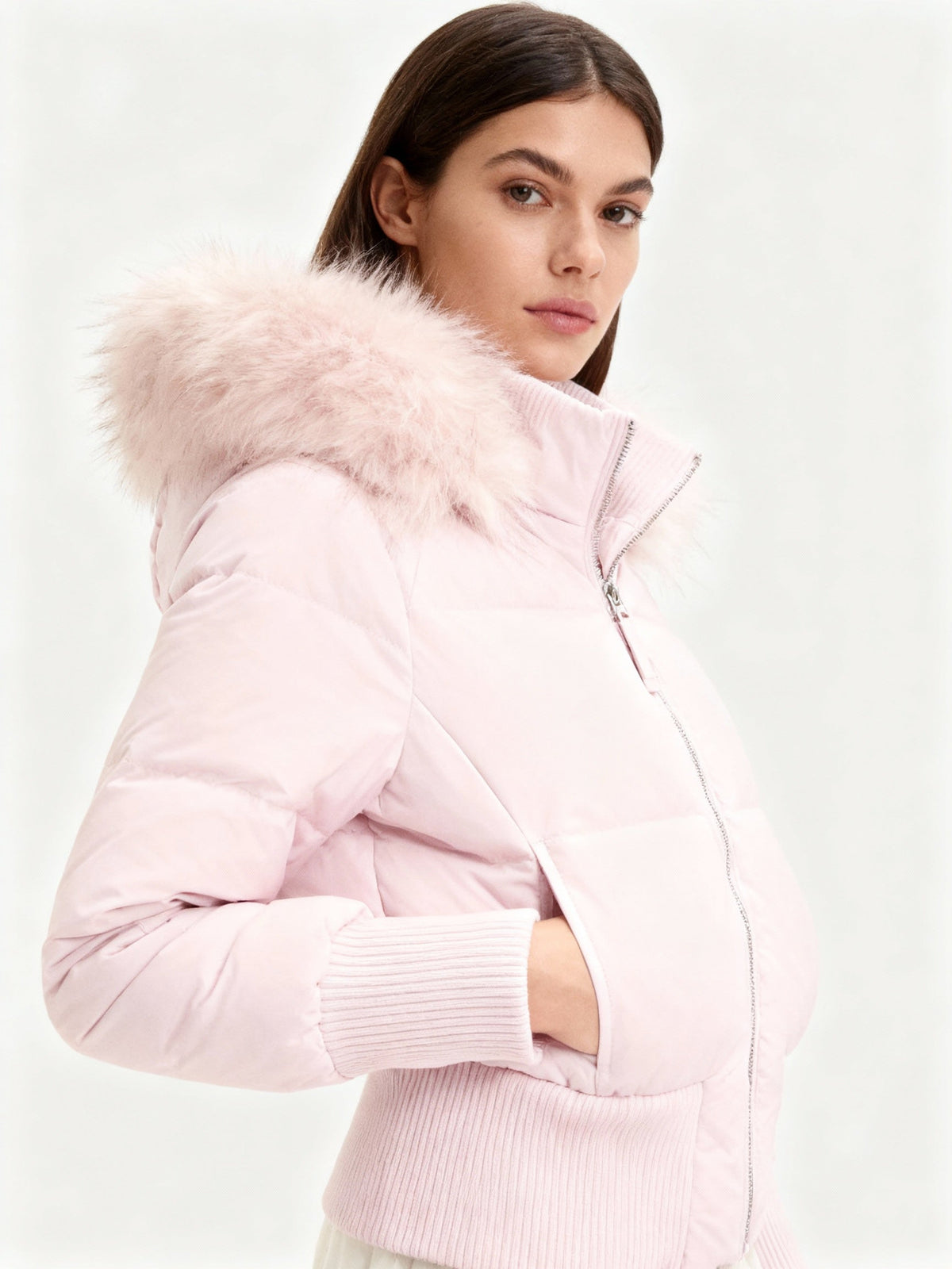 Women's quilted hooded puffer jacket with faux fur trim and zipped pockets