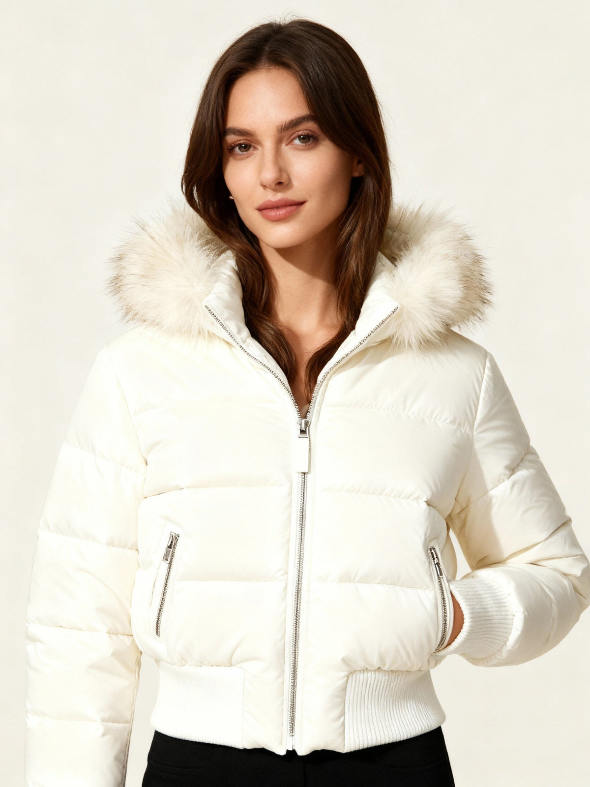 Women's quilted hooded puffer jacket with faux fur trim and zipped pockets