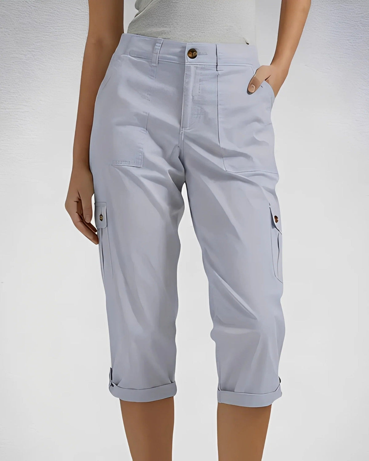 Women's cropped cargo trousers with rolled cuffs and multiple utility pockets