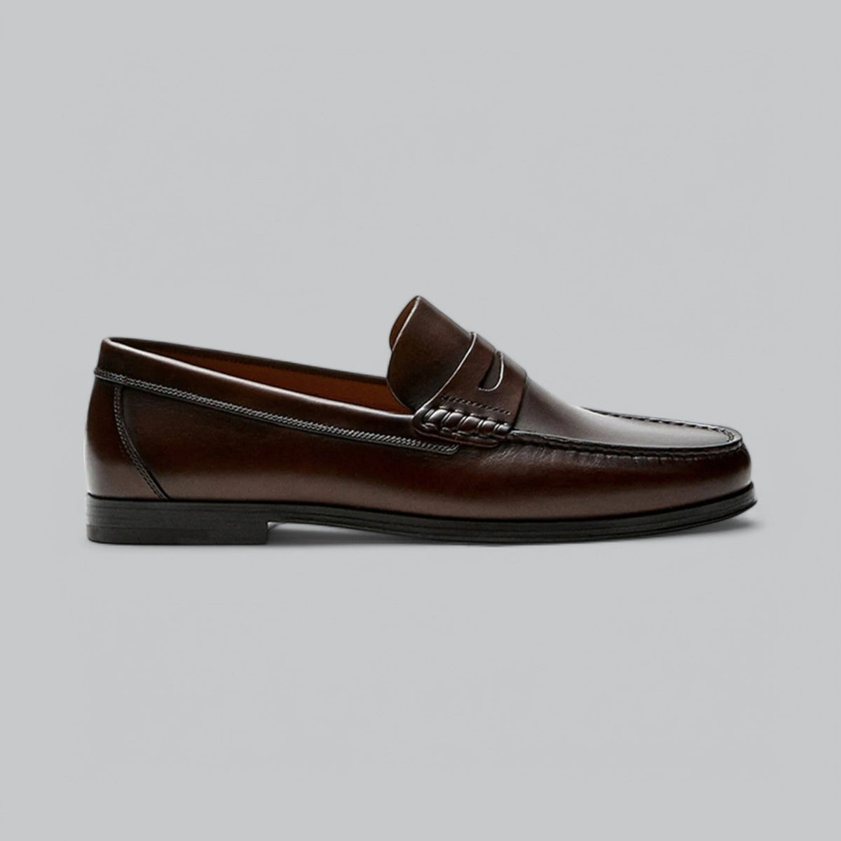Men's classic penny loafers with moc toe stitching and low heel