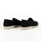 Black men's moccasin loafers with rounded toes and light flat soles