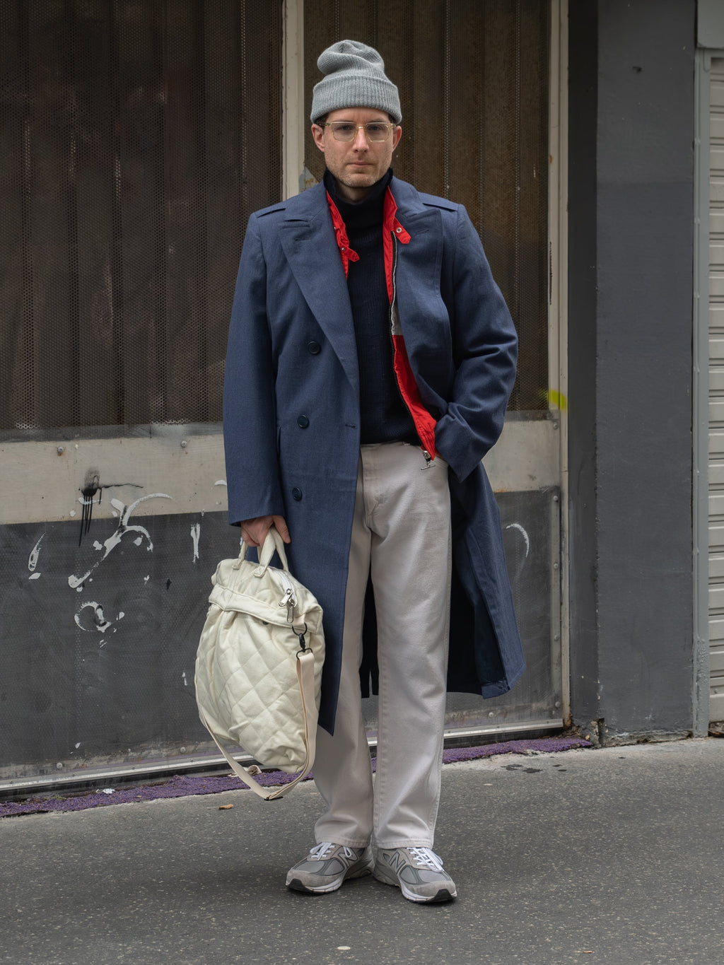 Men's navy double-breasted longline overcoat with notched lapels