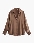 Women's long sleeve collared shirt with button front and wide cuffs