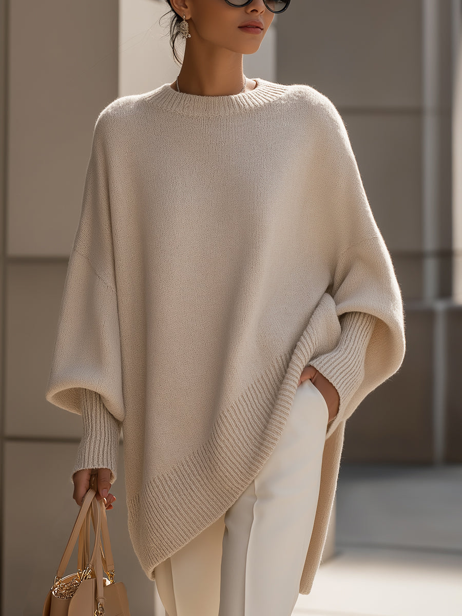 Women's oversized knitted jumper with crew neck, long sleeves and asymmetric hem