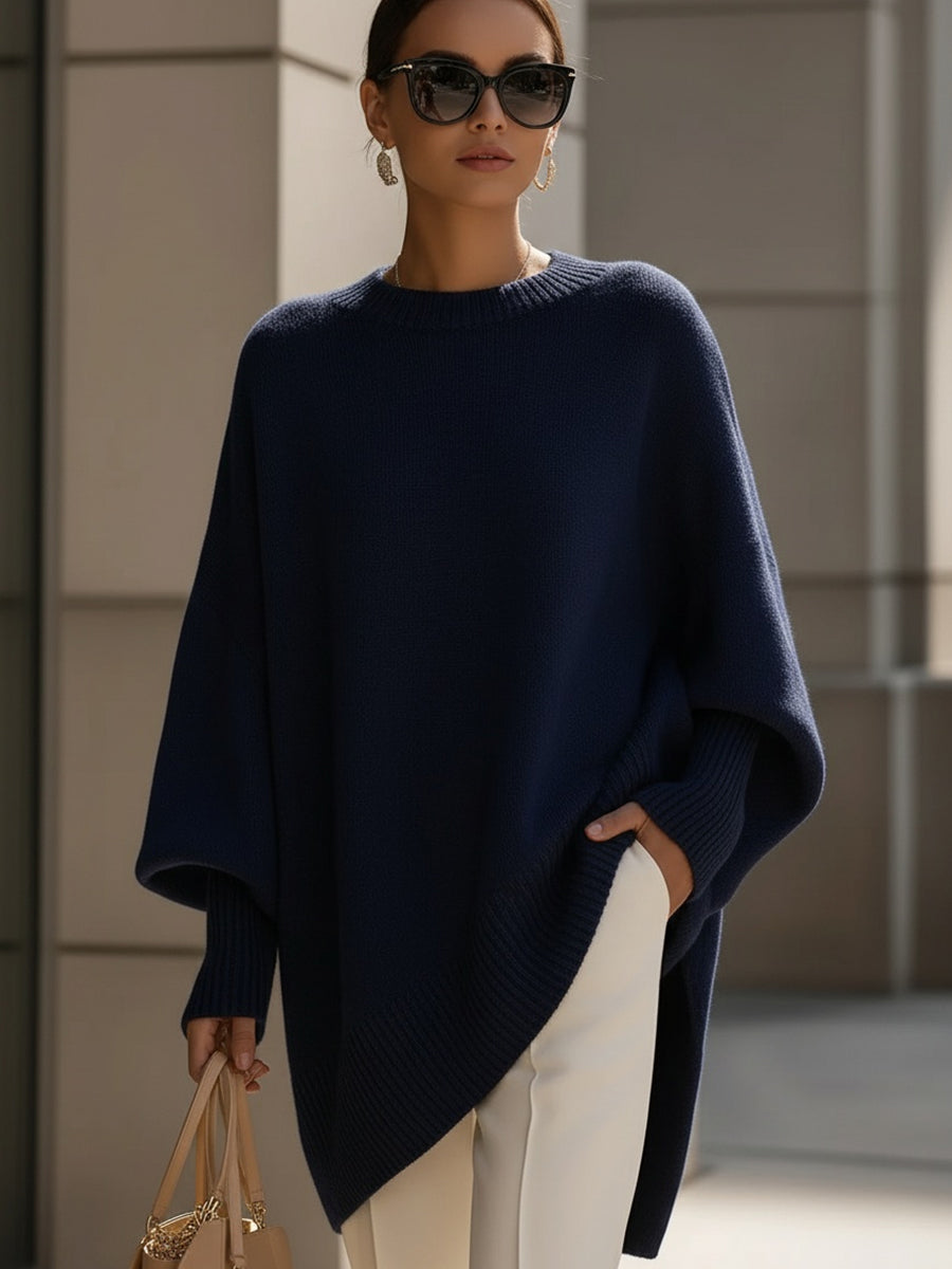 Women's oversized knitted jumper with crew neck, long sleeves and asymmetric hem