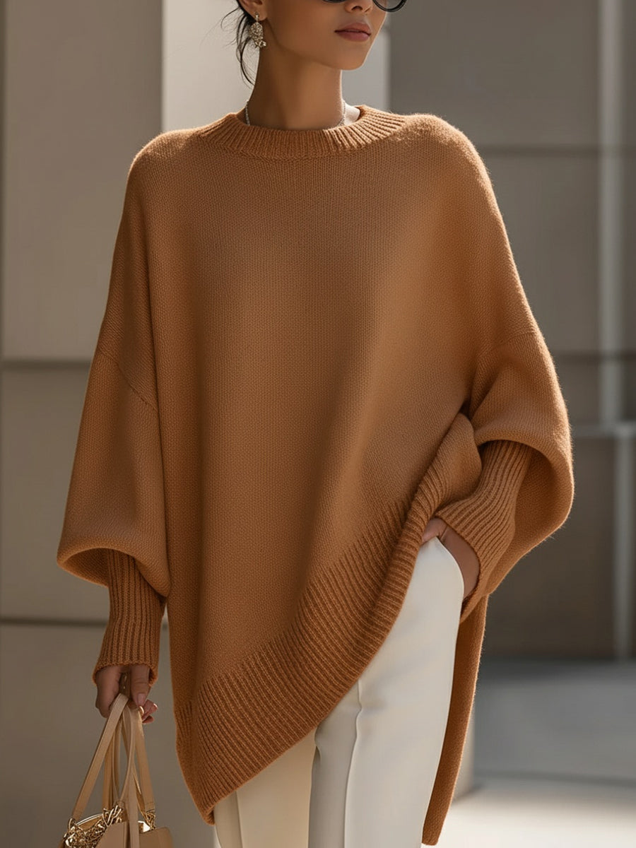 Women's oversized knitted jumper with crew neck, long sleeves and asymmetric hem