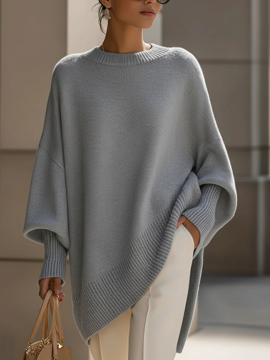 Women's oversized knitted jumper with crew neck, long sleeves and asymmetric hem