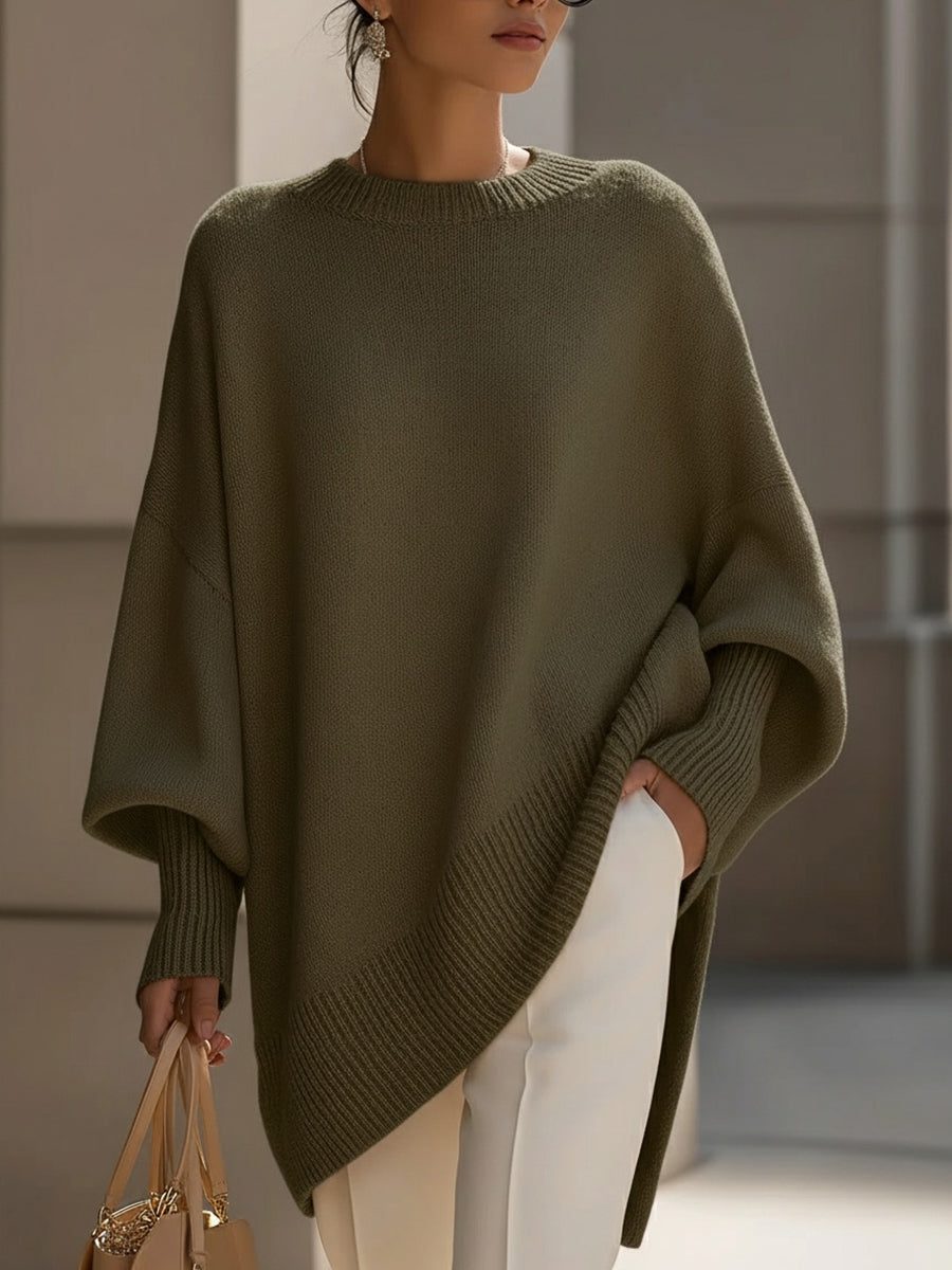 Women's oversized knitted jumper with crew neck, long sleeves and asymmetric hem