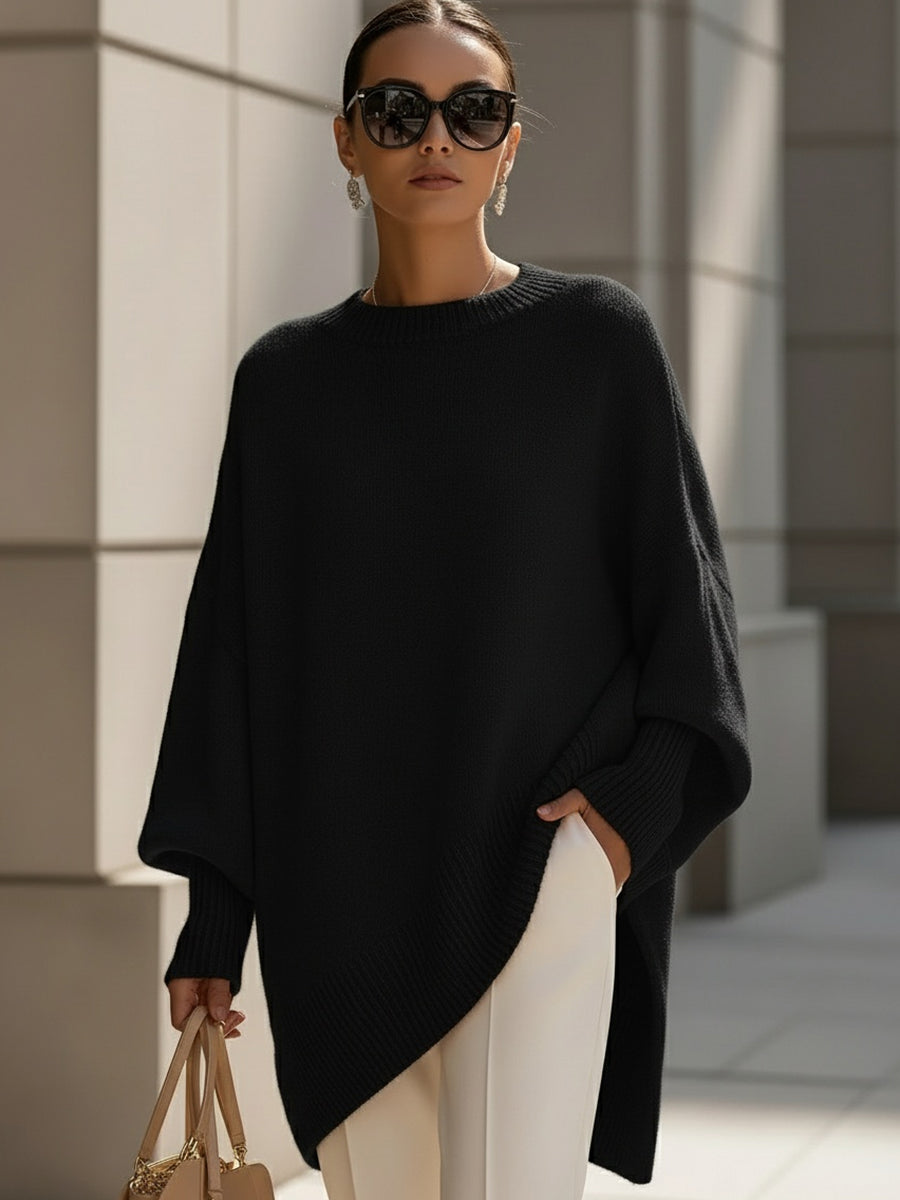 Women's oversized knitted jumper with crew neck, long sleeves and asymmetric hem