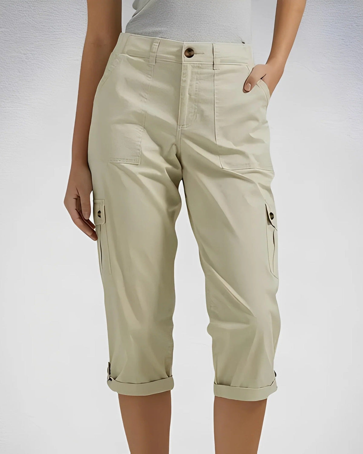 Women's cropped cargo trousers with rolled cuffs and multiple utility pockets