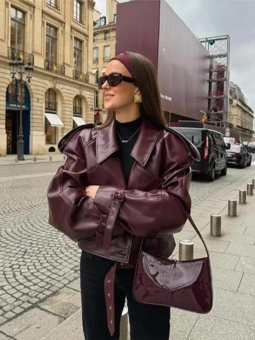 Women's burgundy oversized jacket with wide lapels, structured shoulders and a waist belt