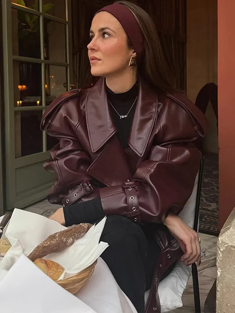 Women's burgundy oversized jacket with wide lapels, structured shoulders and a waist belt