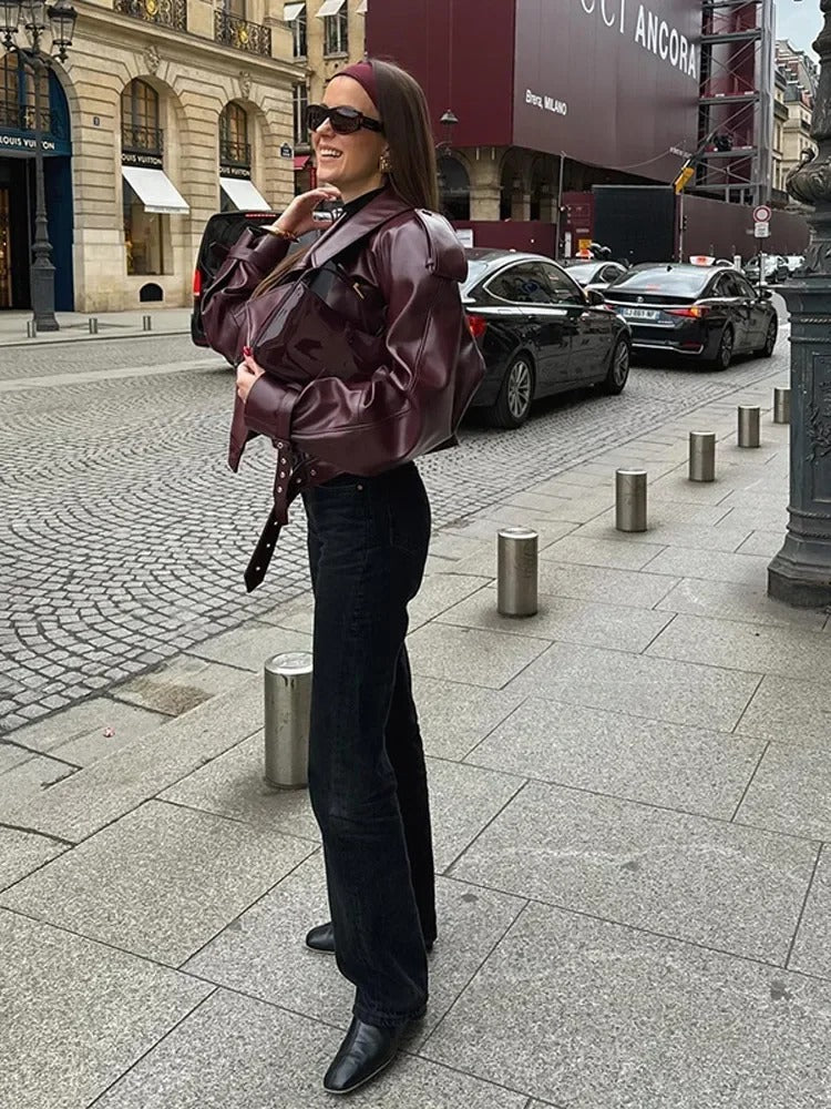 Women's burgundy oversized jacket with wide lapels, structured shoulders and a waist belt