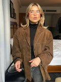 Women's brown oversized blazer with shaped shoulders and notched lapels
