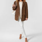 Women's relaxed lapel jacket with long sleeves, button front and flap pockets