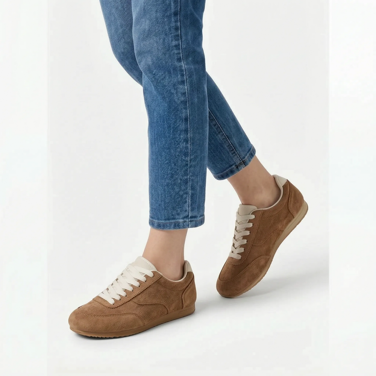 Women's plain low-top lace-up trainers with textured panels and flat soles