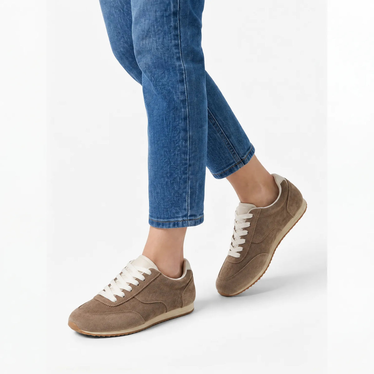Women's plain low-top lace-up trainers with textured panels and flat soles