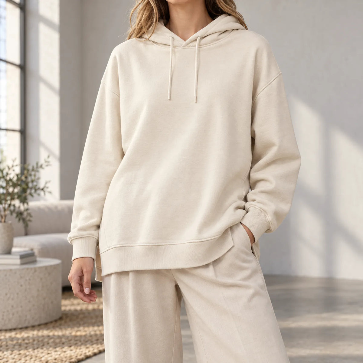 Women's oversized hooded hoodie with long sleeves and asymmetric hem