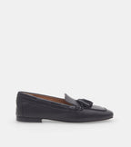 Women's black slip-on loafers with tassel detailing and low heels